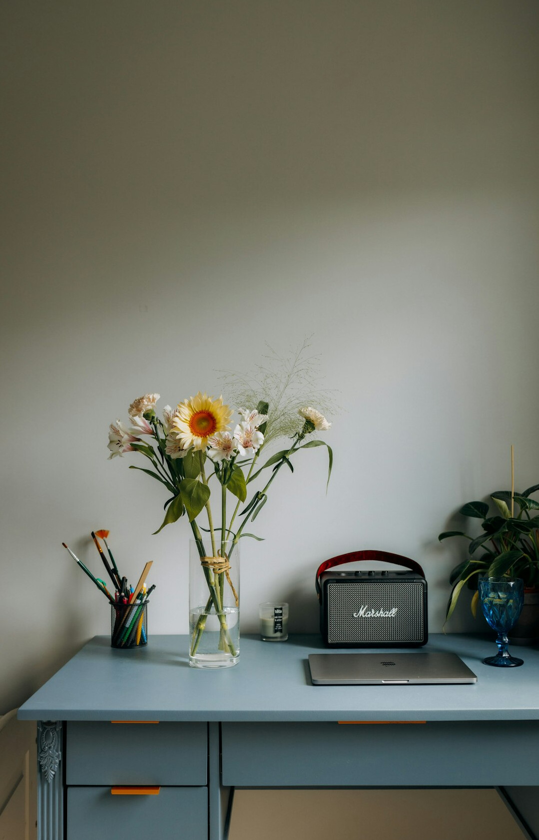 Laptop, notebook and coffee on a wooden desk