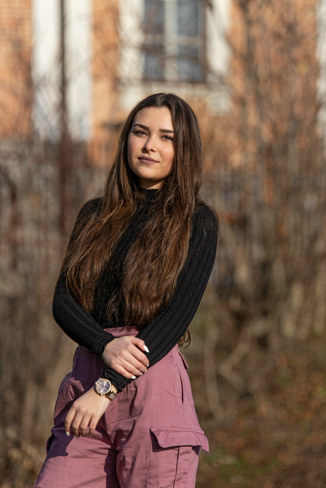 Portrait of a smiling young woman with long brown hair