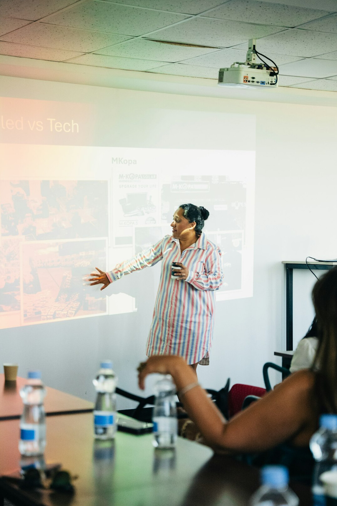 woman presenting to audience