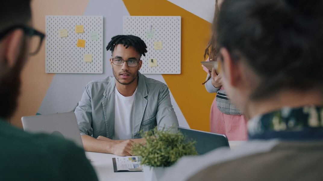 confident person speaking in group